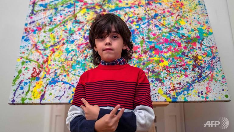 mikail-akar-poses-in-front-of-champi.jpg mikail-akar-poses-in-front-of-champi.jpg