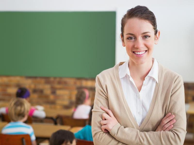 bigstock-pretty-teacher-smiling-at-came-69887626_23.jpg