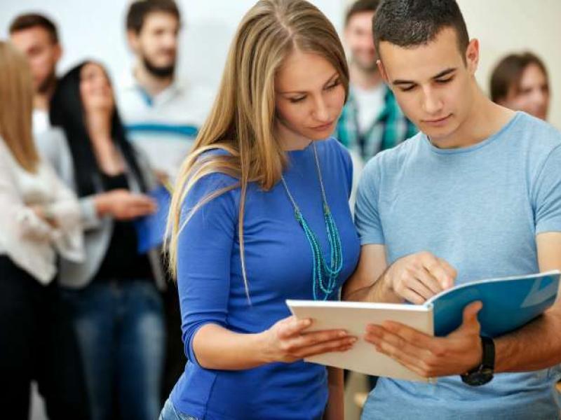 bigstock-two-college-students-reading-b-49888535_0.jpg
