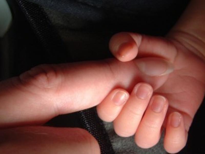 parent_and_baby_hands.jpg