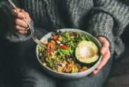 woman-eating-healthy-vegetarian-dinner-from-buddha-bowl-close-up.jpg