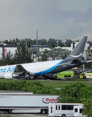 An Amazon cargo plane sits at the Miami International Airport (MIA) after it overshot the runway, Sunday, Sept. 6, 2026. (AP Photo/David Fischer)