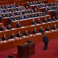 Chinese Premier Li Qiang bows before delivering his report during the opening session of the National People's Congress (NPC) in Beijing, Thursday, March 5, 2026. (AP Photo/Andy Wong)