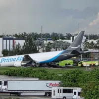 An Amazon cargo plane sits at the Miami International Airport (MIA) after it overshot the runway, Sunday, Sept. 6, 2026. (AP Photo/David Fischer)