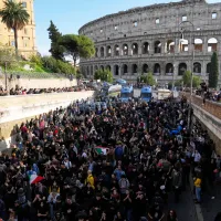 Antiwar activists demonstrate against rearmament and Italy's involvement in wars in front of the Colosseum in Rome, Saturday, Oct. 24, 2026, during one of several protests in Italy organized by groups across the political spectrum