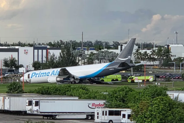 An Amazon cargo plane sits at the Miami International Airport (MIA) after it overshot the runway, Sunday, Sept. 6, 2026. (AP Photo/David Fischer)